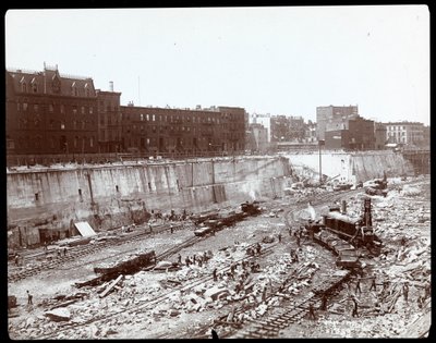 View of workers in the huge excavation for Pennsylvania Station, New York by Byron Company